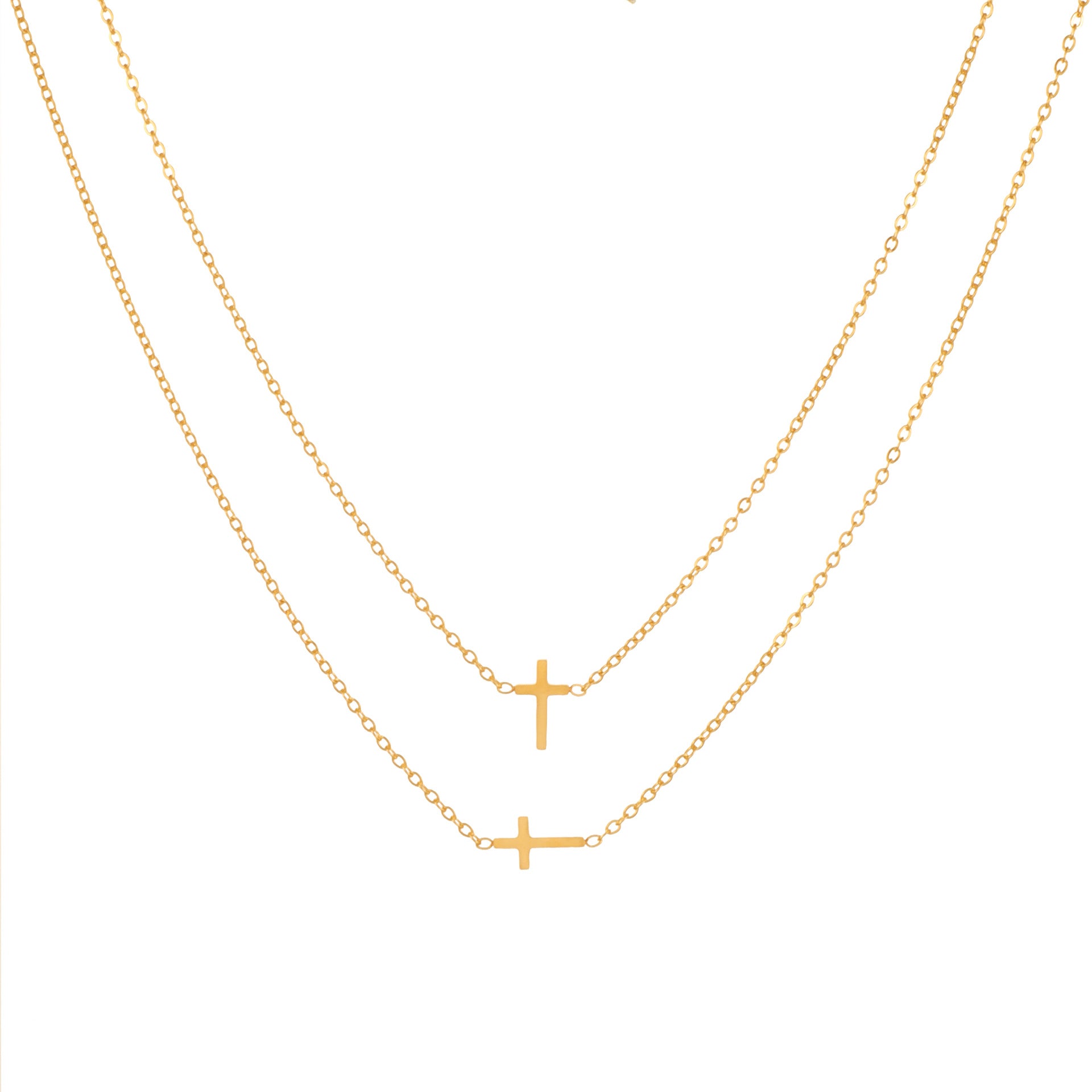 Two delicate gold chain necklaces with small cross pendants, displayed against a solid white background.